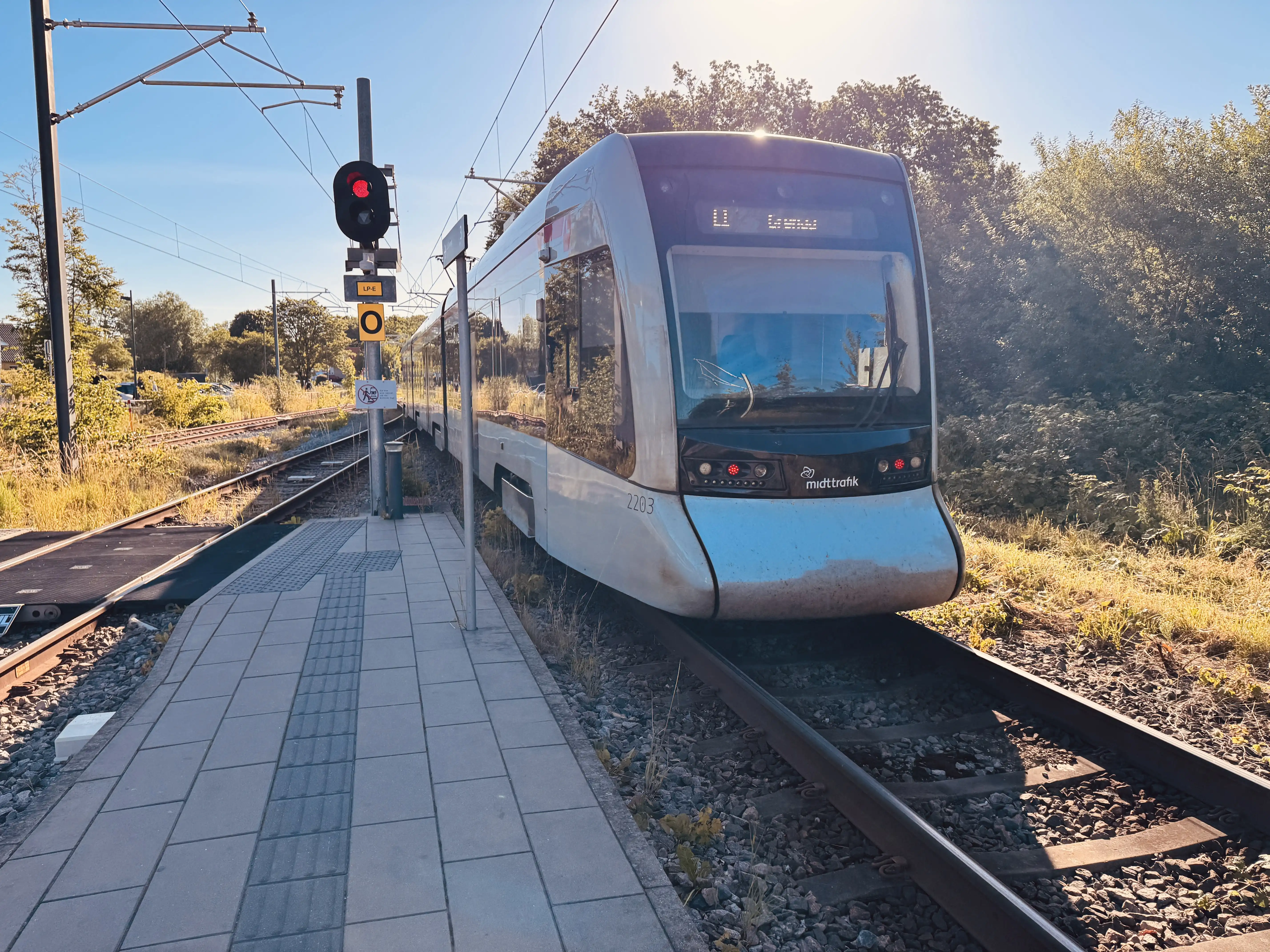Billede af Aarhus Letbane togsæt 2103 fotograferet ud for Lystrup Letbanestation. Billede af Aarhus Letbane togsæt 2103 fotograferet ud for Lystrup Letbanestation.